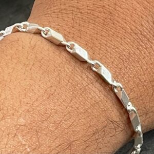 silver bracelet with hand